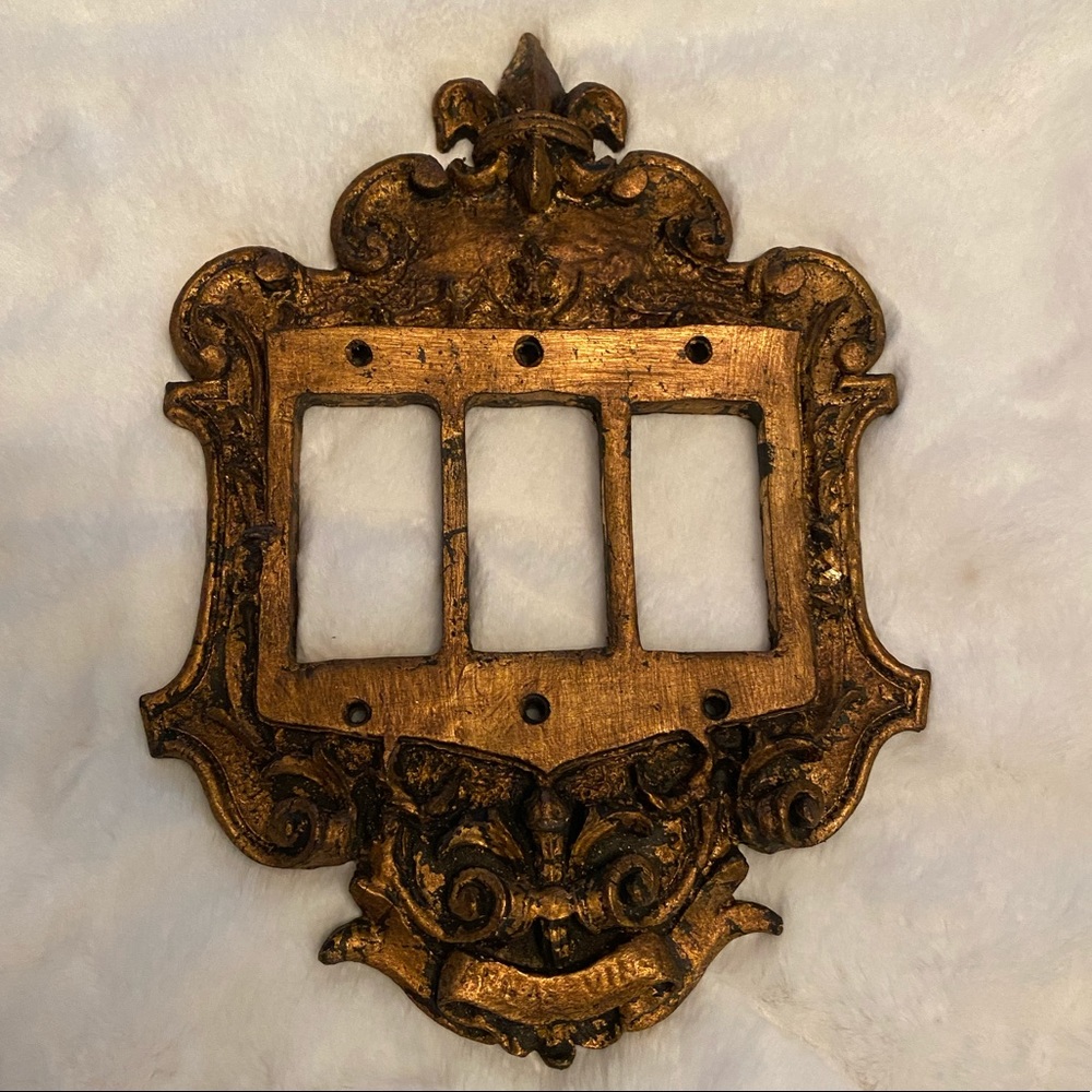 Fleur de lis Old World light switch triple cover.